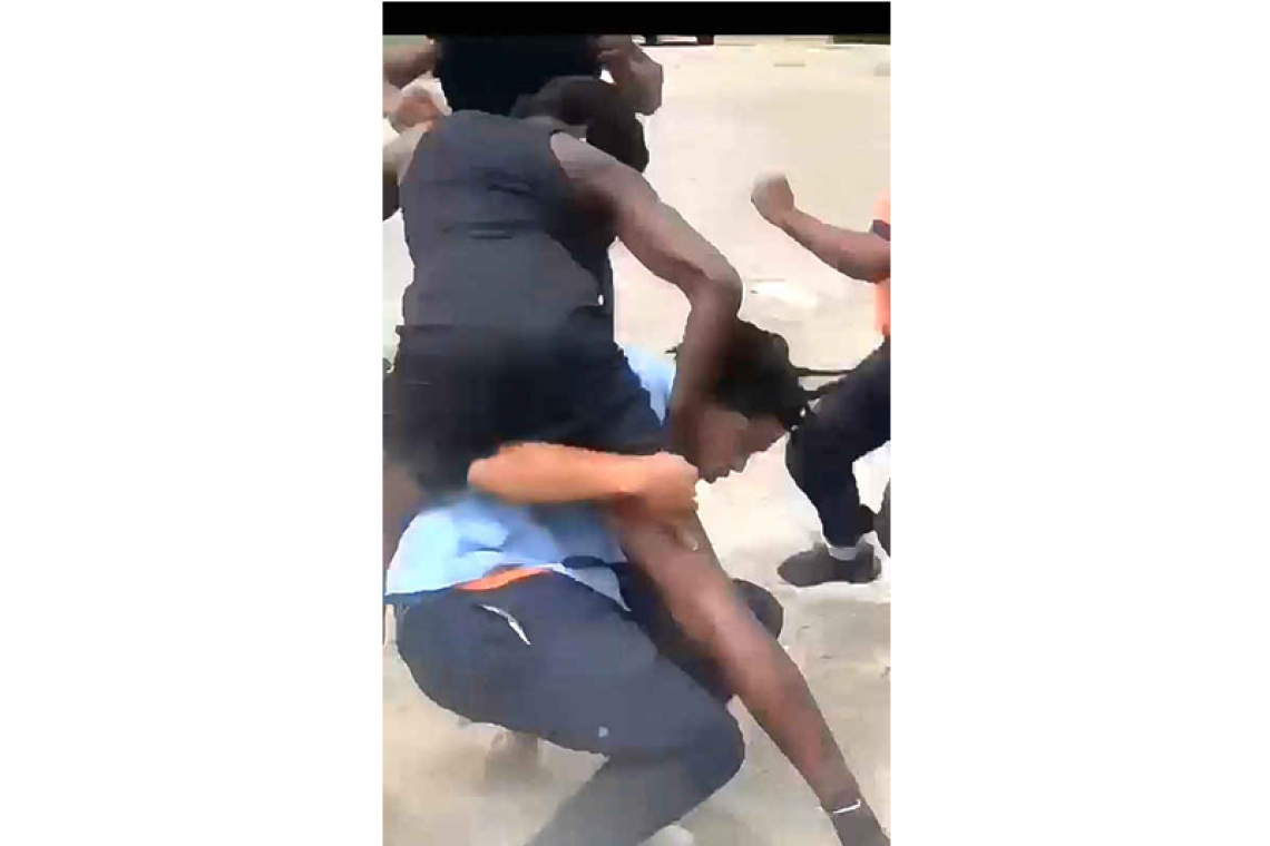 Police arrest former student,  identify youth in school fight