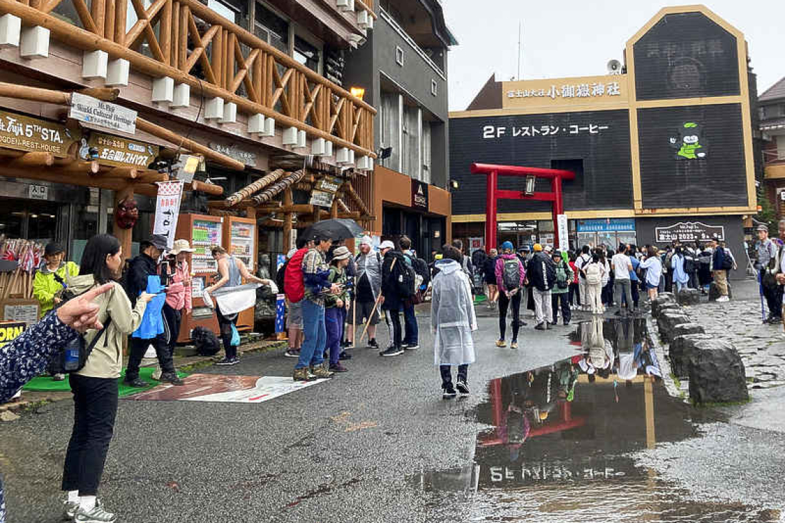 Japan says swarms of tourists defiling sacred Mount Fuji
