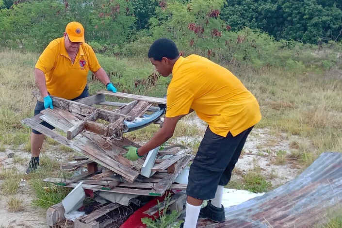 Three service clubs join forces  to clean up shores of Salt Pond