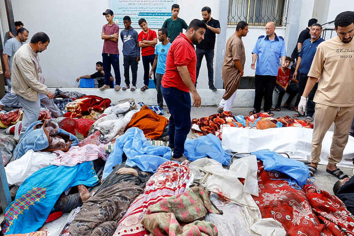 In Gaza's deadliest day, hospital strike kills about 500 