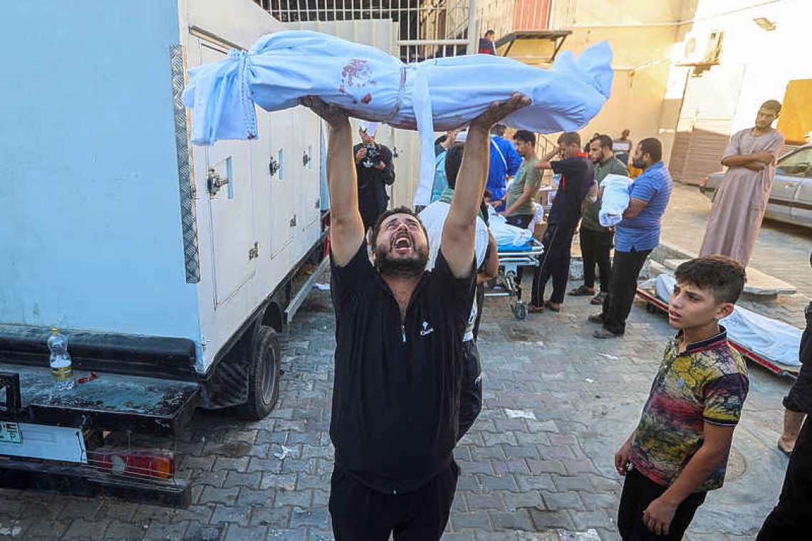 Bodies line Gaza hospital wall and surgeons operate in corridors 