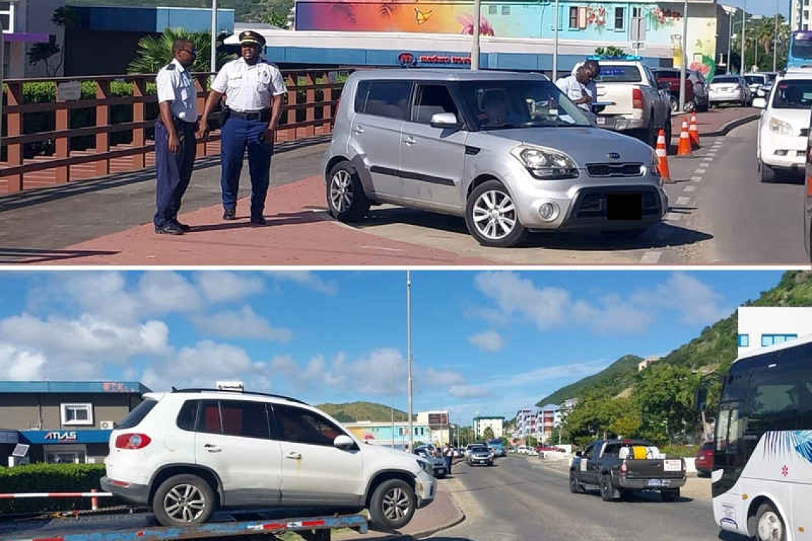 Police inspect cars in Philipsburg to  ensure safety during holiday season