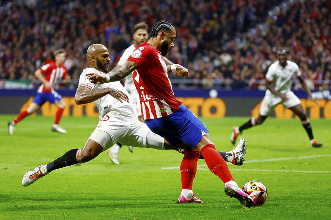 Depay strikes as Atletico beat Sevilla to reach semis