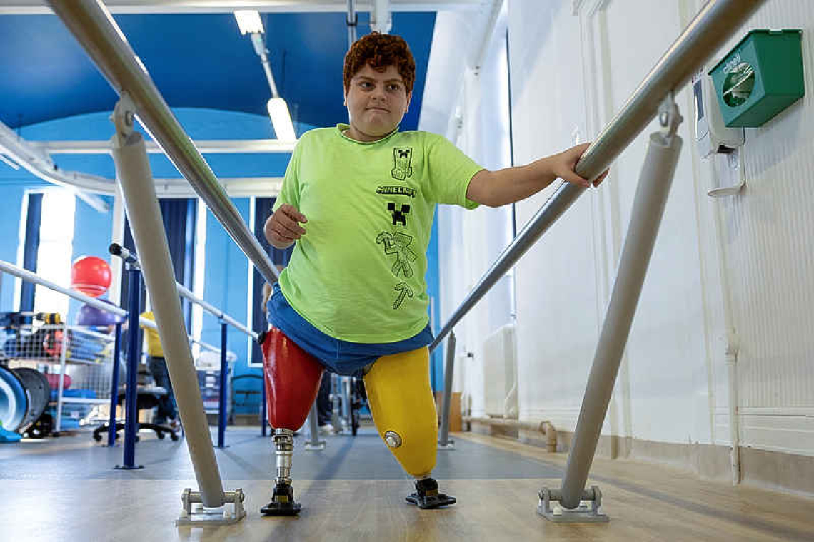 A boy's arduous steps on prosthetic legs year after Turkey's earthquake