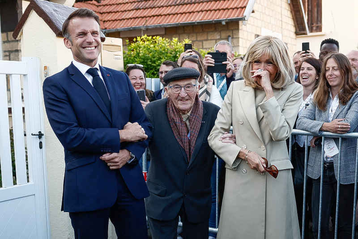 Macron pays tribute to civilian  victims of D-Day bombings