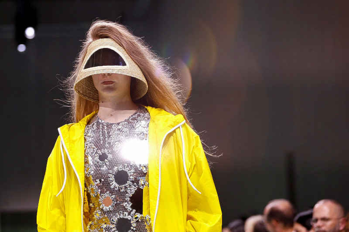 Prada offers metallics, topless hats and hugely oversized lenses