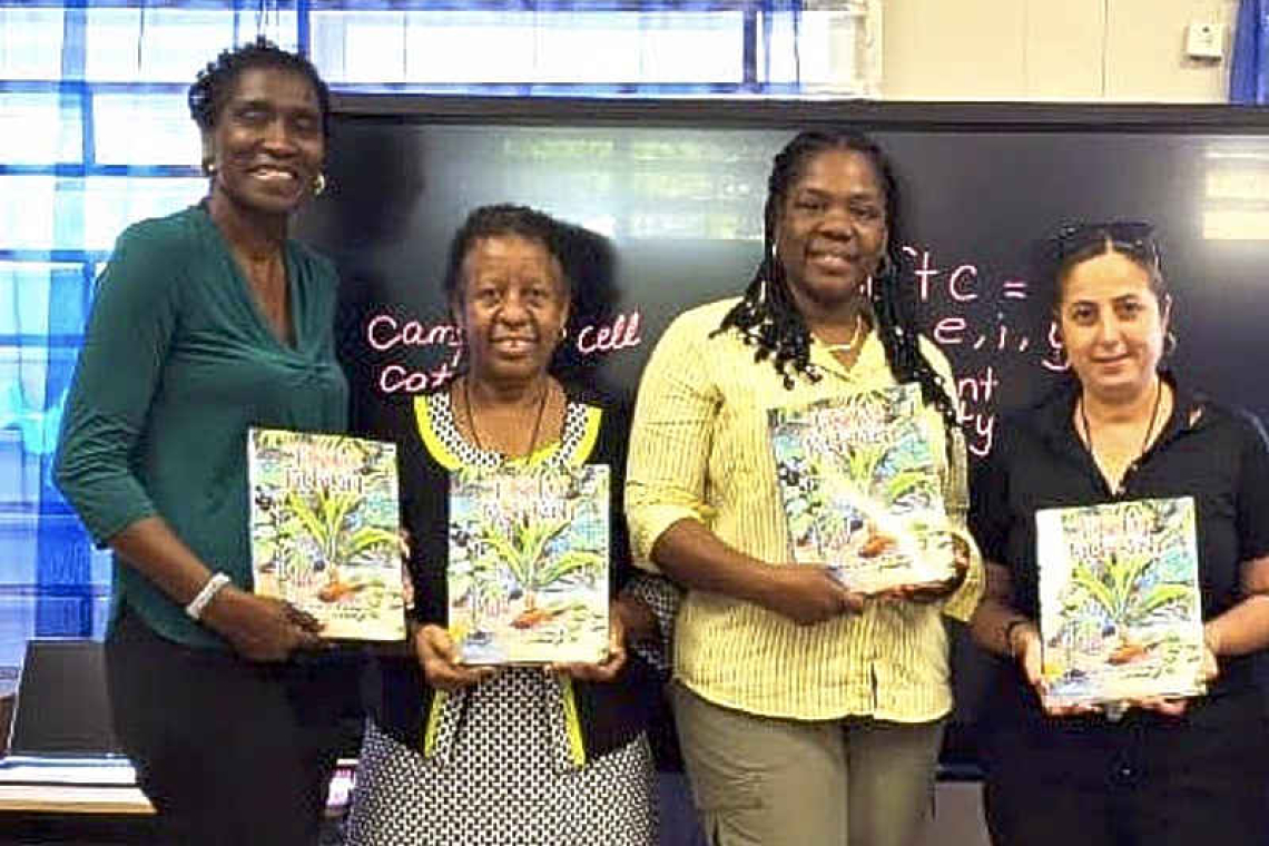 Primary students  receive storybook