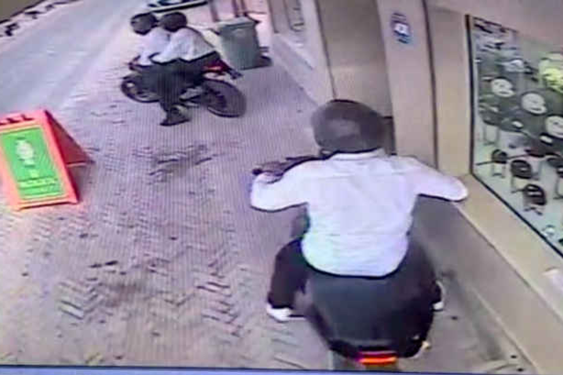 Locked security doors block robbers at  Caribbean Gems, Ama Jewelers robbed