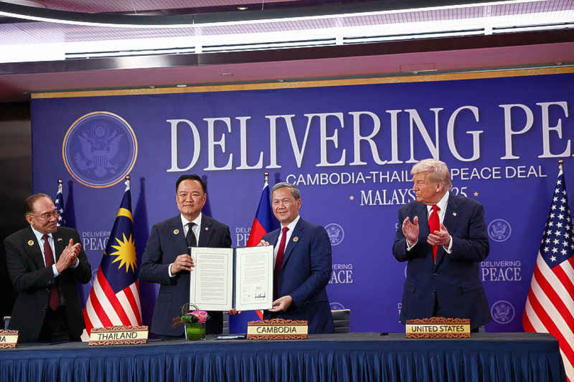 Trump oversees truce signing and  trade deal flurry on first Asian stop