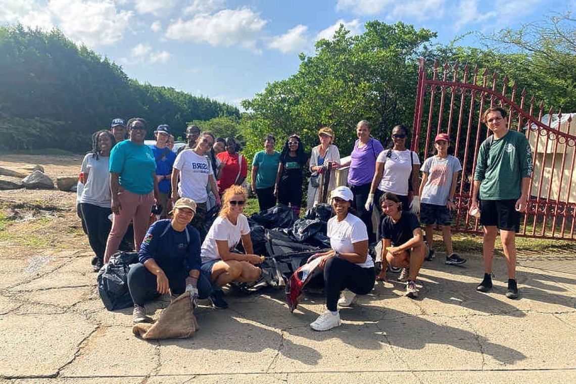65 volunteers remove 5 truckloads  of garbage from Little Bay Pond