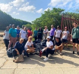 65 volunteers remove 5 truckloads  of garbage from Little Bay Pond