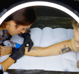 Ukrainians turn to tattoos  to ease the grief from war