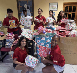 Teen Times delivers wrapped gifts and  school supplies to Leaders for Change