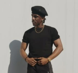       Local dancer Jay Mills flies St. Maarten  flag at Super Bowl halftime performance