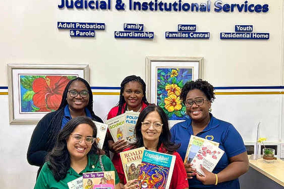 Rotary Club Mid Isle gifts  books for children to J&IS