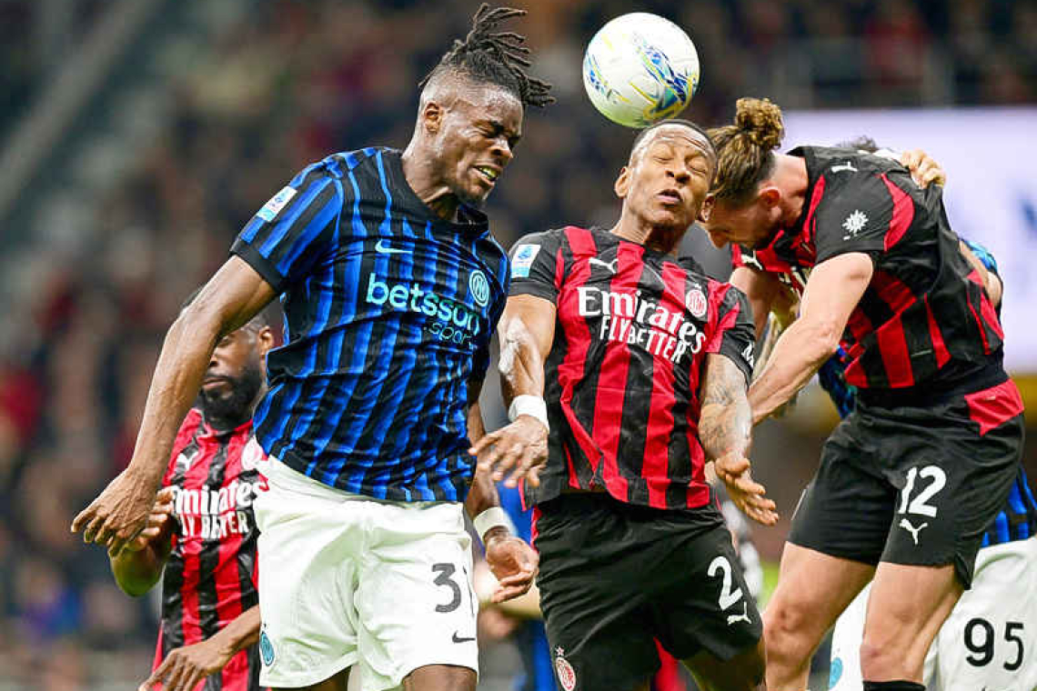 Milan edge Inter in derby to keep distant title chase alive