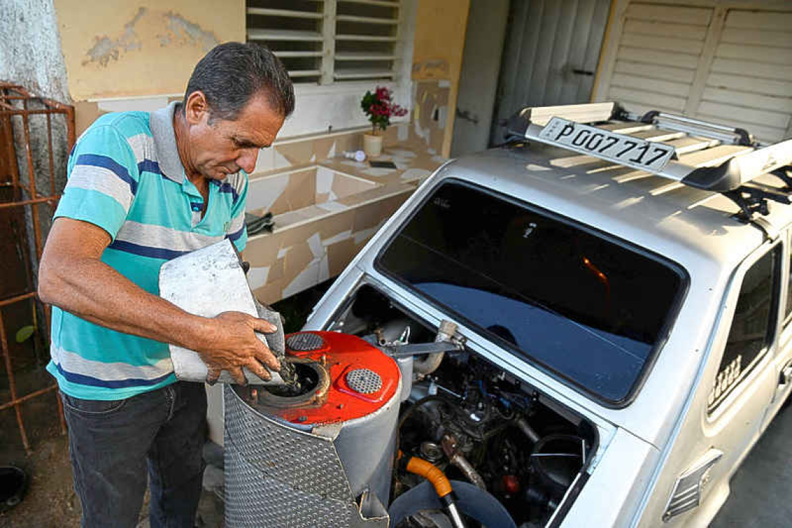 Facing US oil blockade, Cuban  man powers car with charcoal