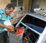 Facing US oil blockade, Cuban  man powers car with charcoal
