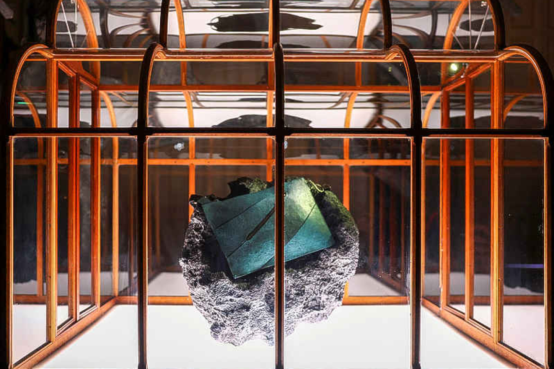 T-rex collagen used to create  one-of-a-kind teal handbag