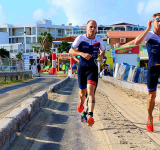Pigeon flies across finish line at  Sunset Triple Mini Triathlon