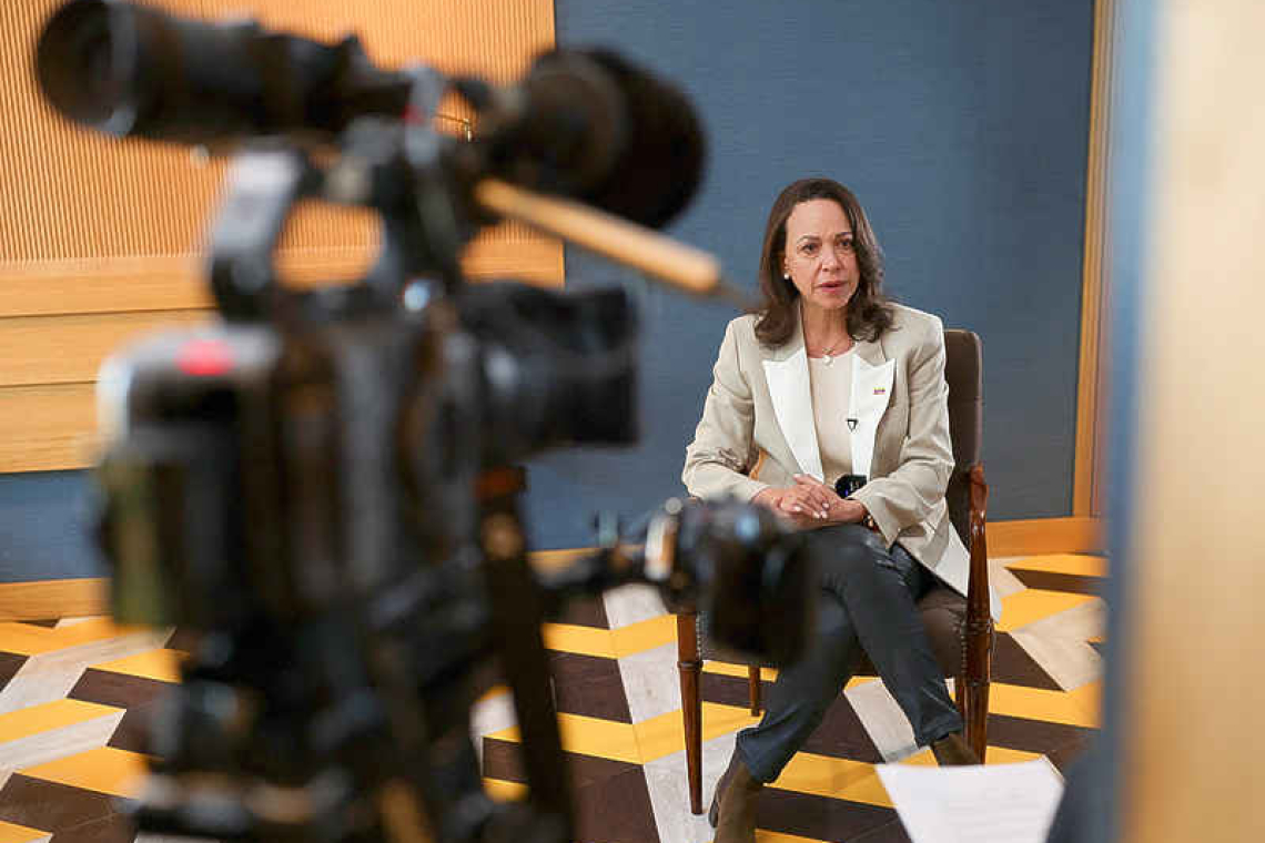 Machado plans to return home by  end of year, urges swift elections