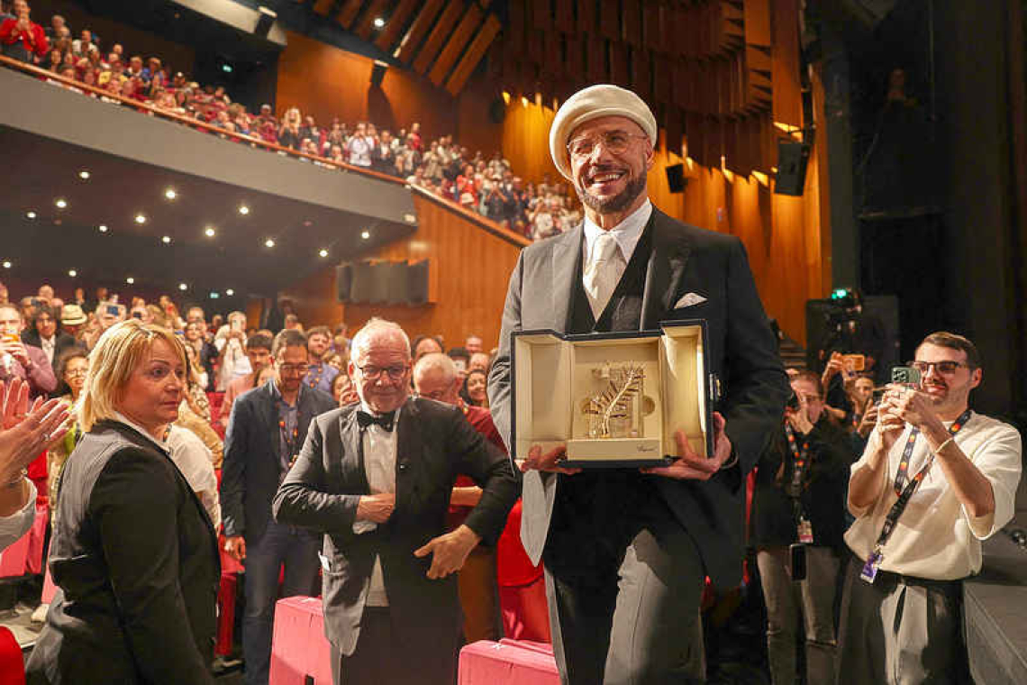 Travolta surprised with Cannes  award ahead of directorial debut
