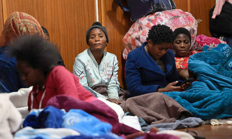 African migrants flee into the mountains as  South Africa's xenophobic violence surges