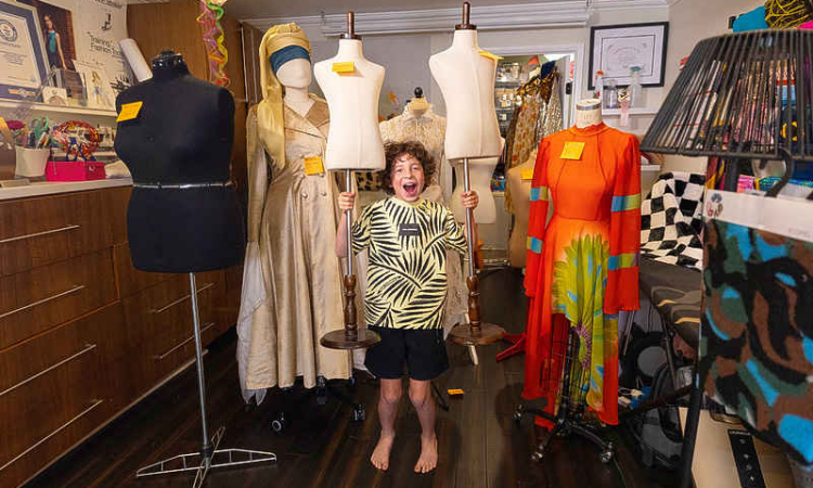 Ten-year-old American fashion designer  shuttles between school and runways