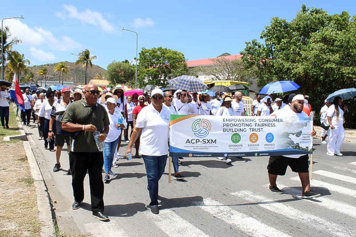 Fed-up GEBE consumers take stand  during well attended protest march