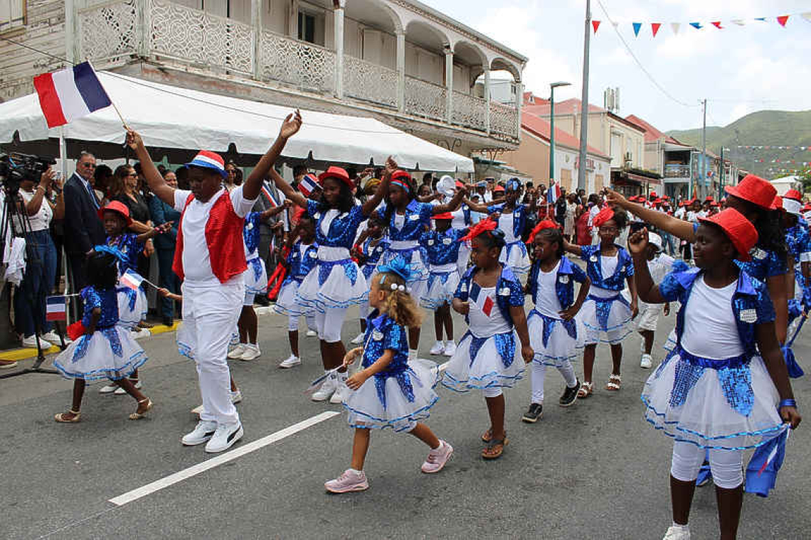 Collectivité awards certificates for service and  professionalism at annual Bastille Day ceremony