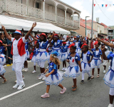 Collectivité awards certificates for service and  professionalism at annual Bastille Day ceremony