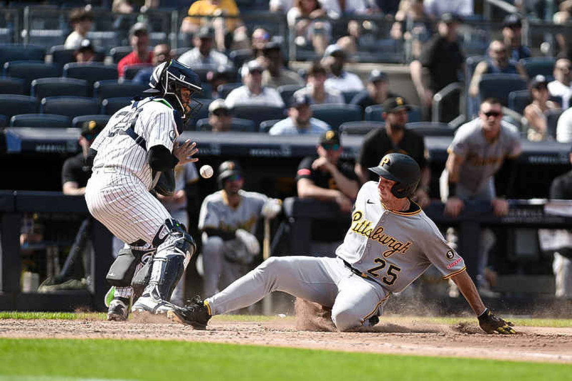 Yankees rally late, but Pirates take DH opener in 10 innings