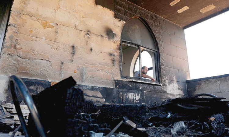 Settlers set fire to West Bank  mosques after deadly clash