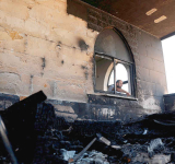 Settlers set fire to West Bank  mosques after deadly clash