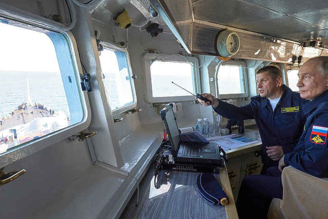 Putin visits disputed island near Japan, drawing Tokyo's ire