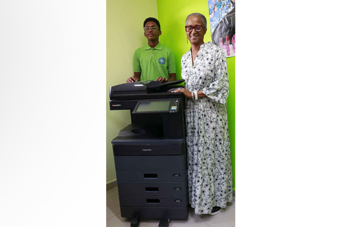 St. Dominic Alum donates  $5,101 for library printer