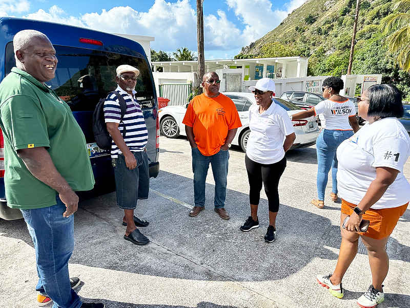 Candidates_of_3_parties_and_supporters_outside_polling_station_The_Bottom.jpg